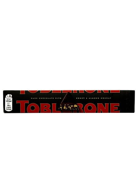 Чорний шоколад Toblerone з медово-мигдальною нугою 100 г 204 фото